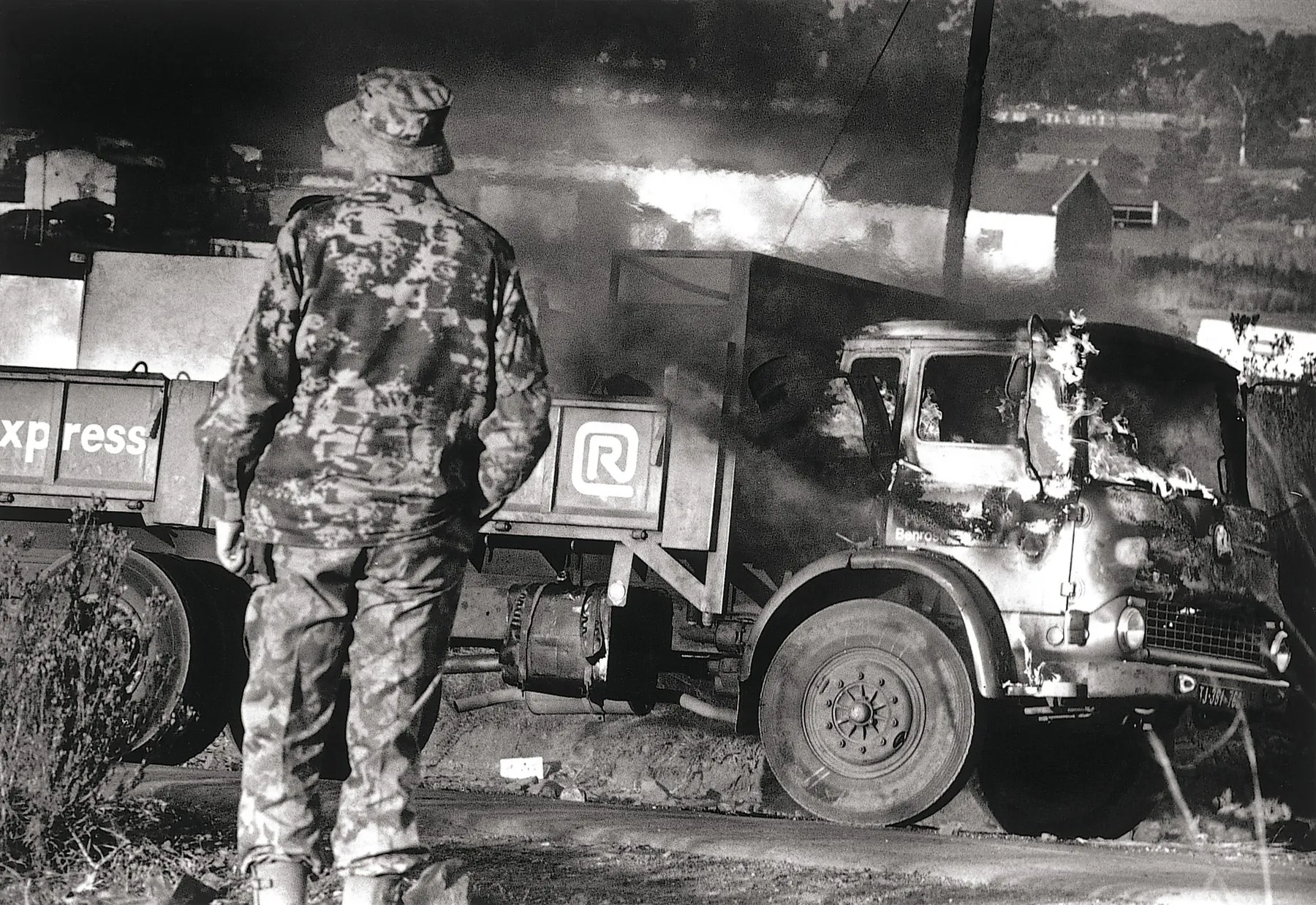 A burning truck next to Moroka Police Station conveys the mood of the era.